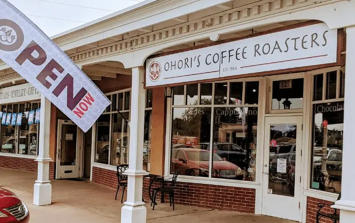 Storefront of Ohori's Coffee Roasters with 'Open Now' flag displayed outside.