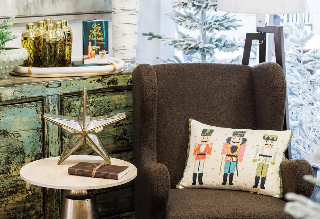 Cozy holiday-themed room with nutcracker pillow, star decor, and festive decorations.