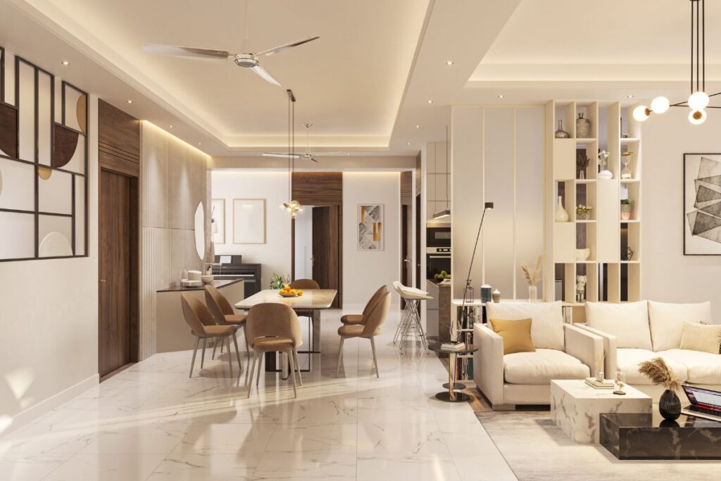 Open-plan living and dining area with marble floors, a beige sofa by a low coffee table, a wood dining table surrounded by upholstered chairs, and built-in shelving under recessed lighting.
