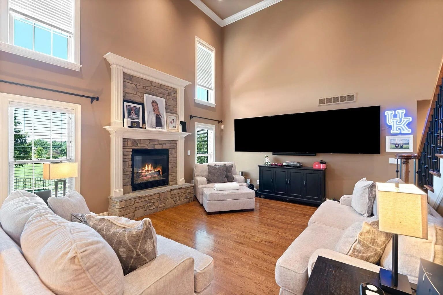 Spacious living room with a fireplace, large TV, and comfortable seating.