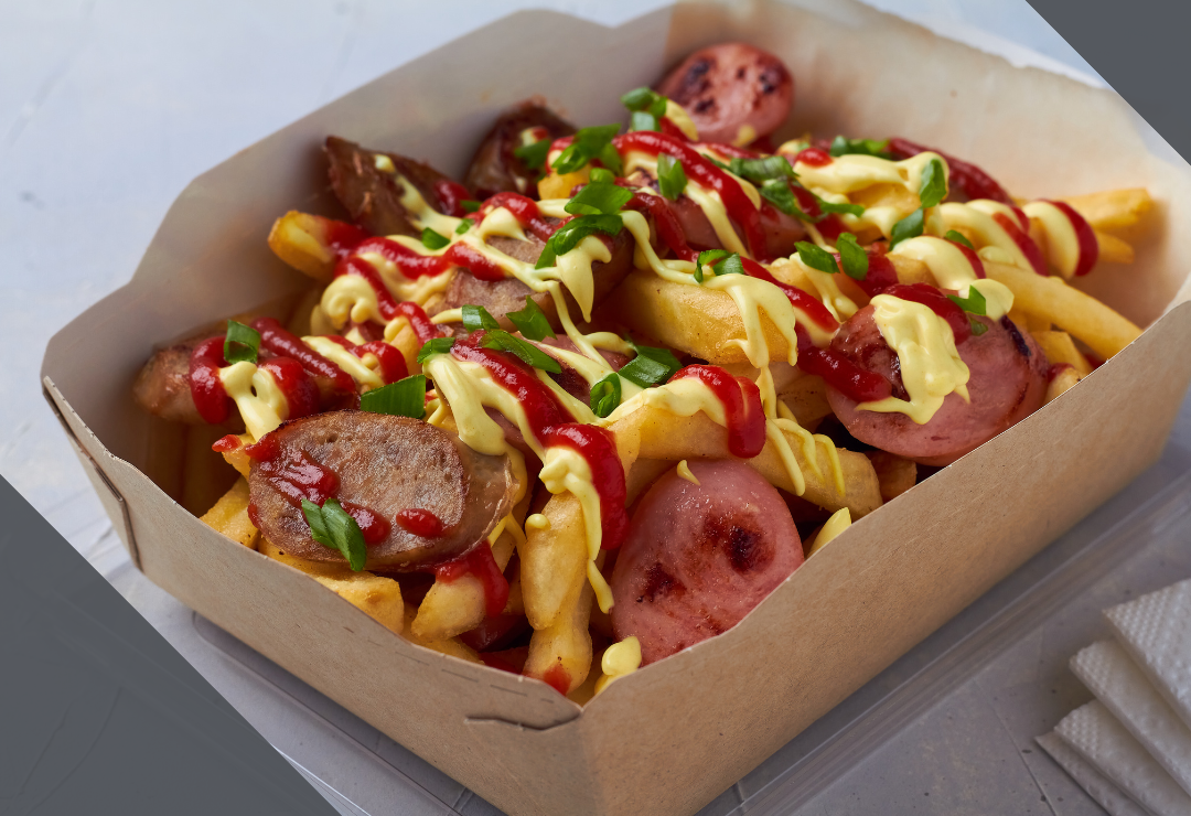 Box of fries topped with sausage slices, ketchup, mayonnaise, and chopped green onions.