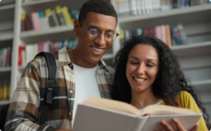 Two people reading a book