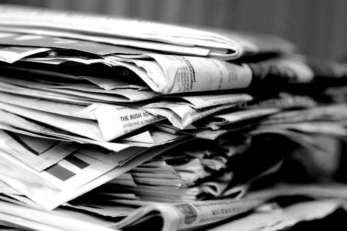 Newspapers-About A black and white stack of newspapers.